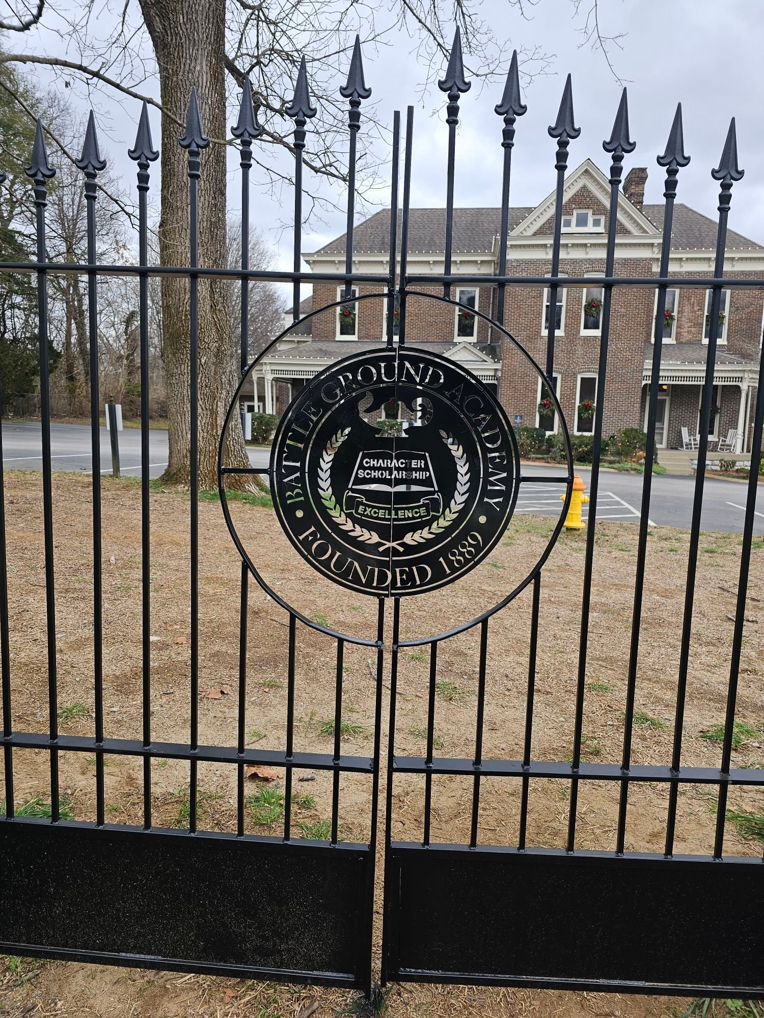 Custom wrought iron gate with CNC cut Battle Ground Academy crest in Franklin TN
