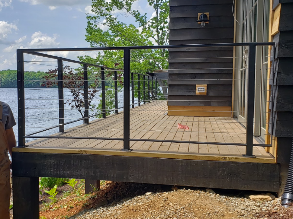 Lakefront deck with custom steel cable railing fabricated by 3D Custom Welding in Middle Tennessee