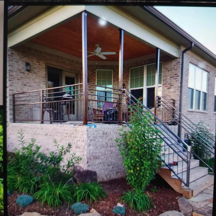 Custom porch railing and stair rail on a brick Middle Tennessee home